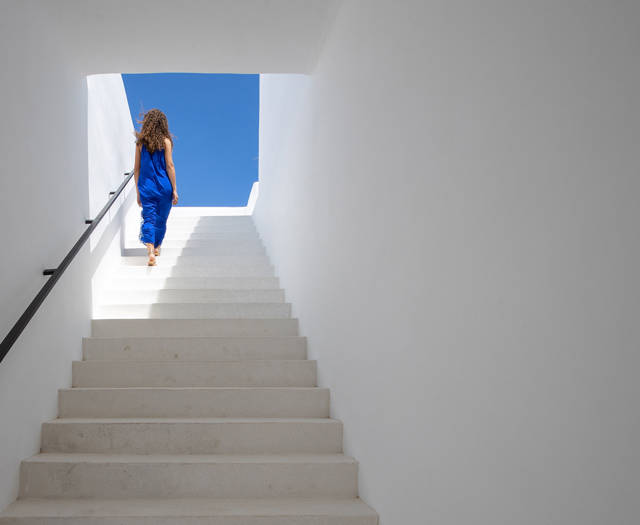 Koukoumi Vegan Hotel visitor going up a staircase