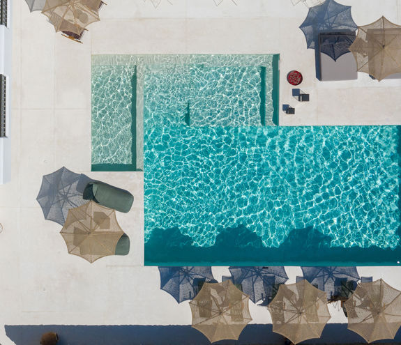Koukoumi Vegan Hotel pool and sunbeds and umbrellas