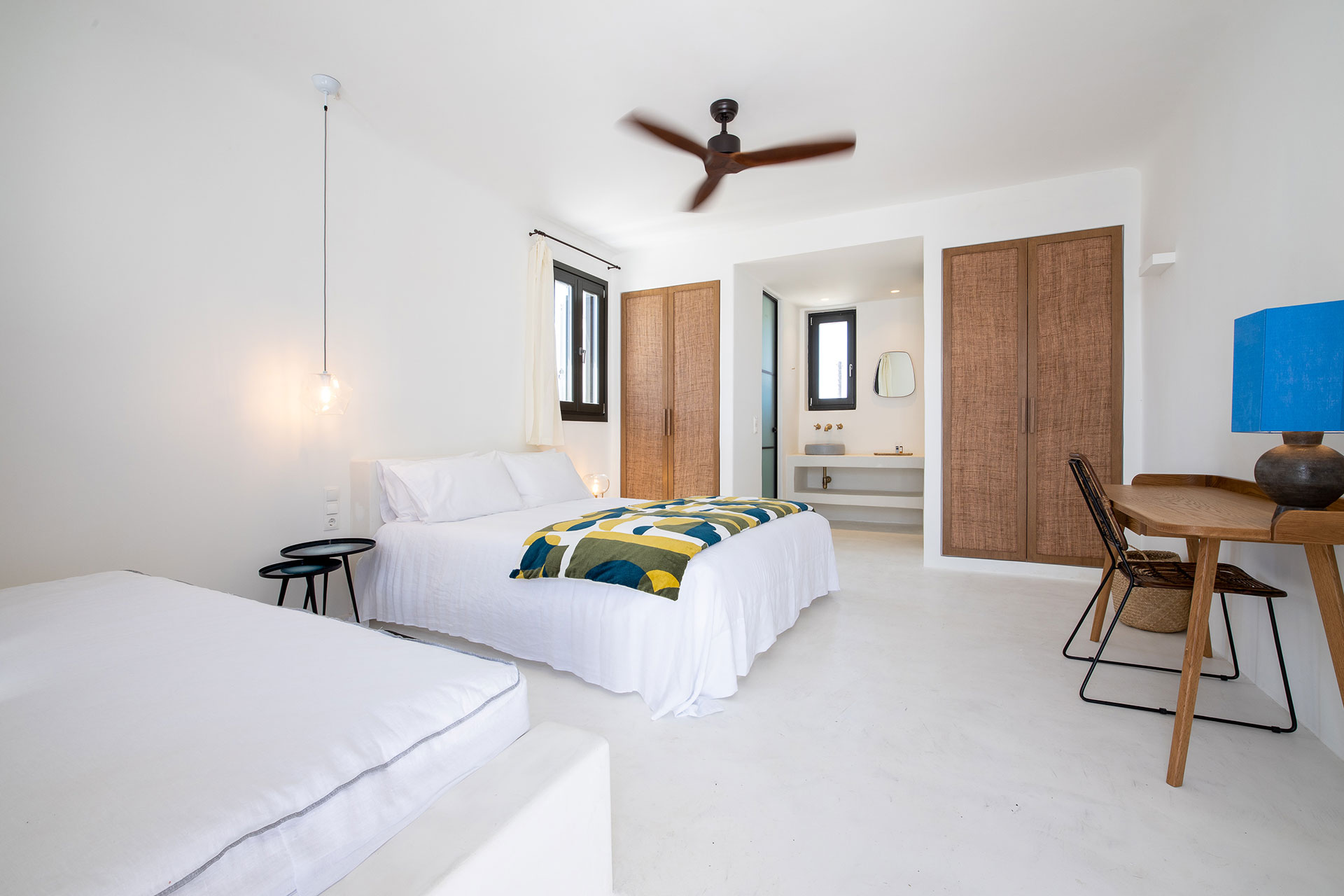 Koukoumi Vegan Hotel executive suite beds and interior