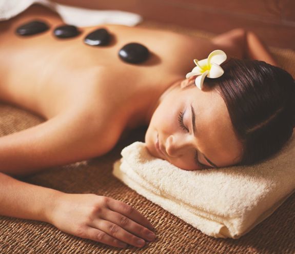 Woman Enjoying Stone Massage