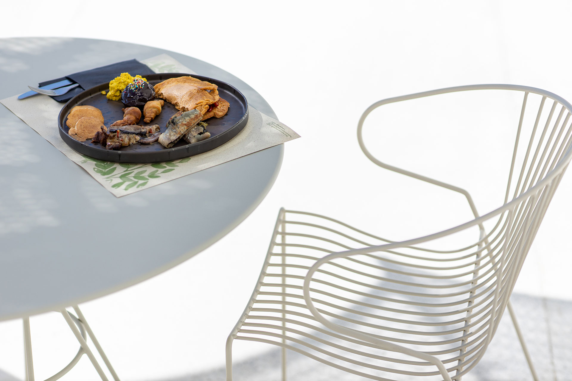 Koukoumi Vegan Hotel restaurant table with a meal on