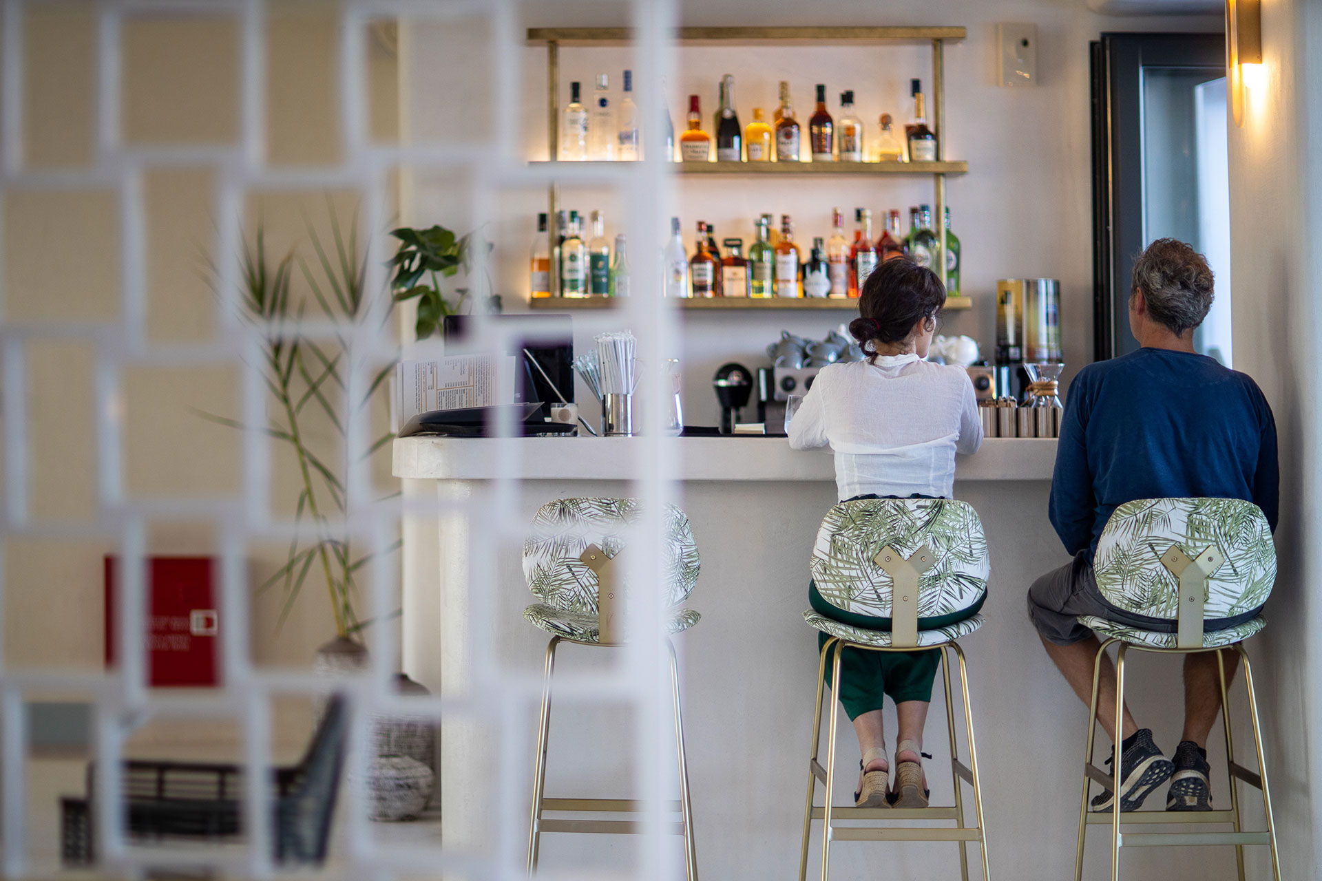 Koukoumi Vegan Hotel visitors sitting at the bar
