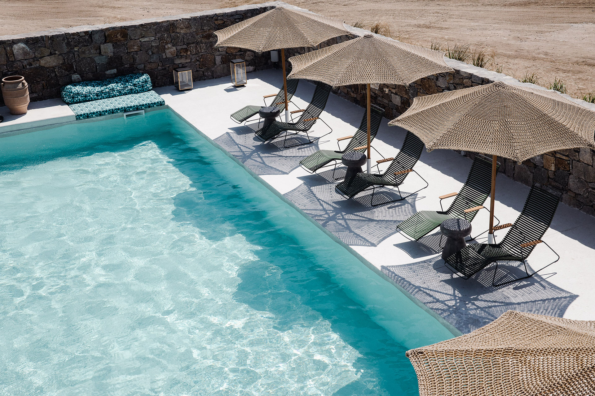 Koukoumi Vegan Hotel pool and sunbeds and umbrellas